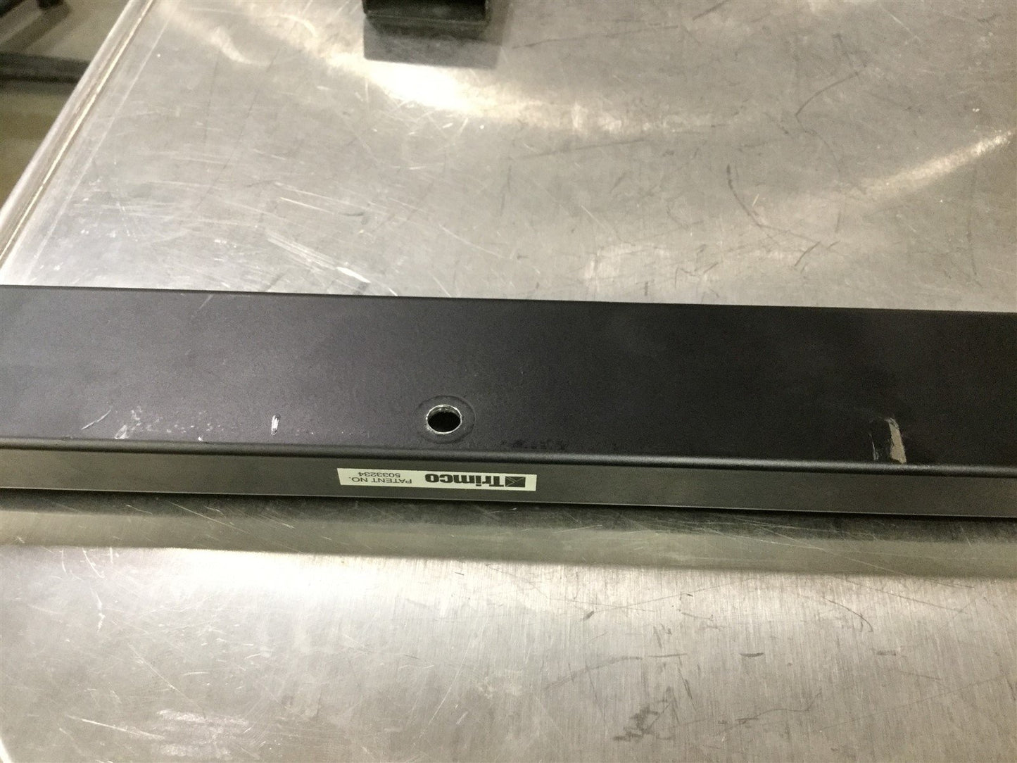 Used Trimco 3094 B-1 Bar Door Coordinator For 53"-63", Length 52" W/ Filler Bar