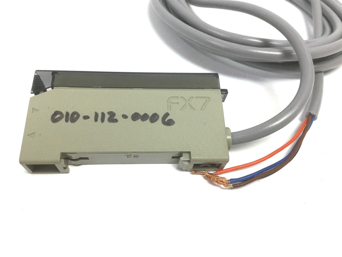 Used Sunx FX-7 Fiber Amplifier, Output: NPN, Brown: 12-24VDC, Black: Output, Blue: 0V