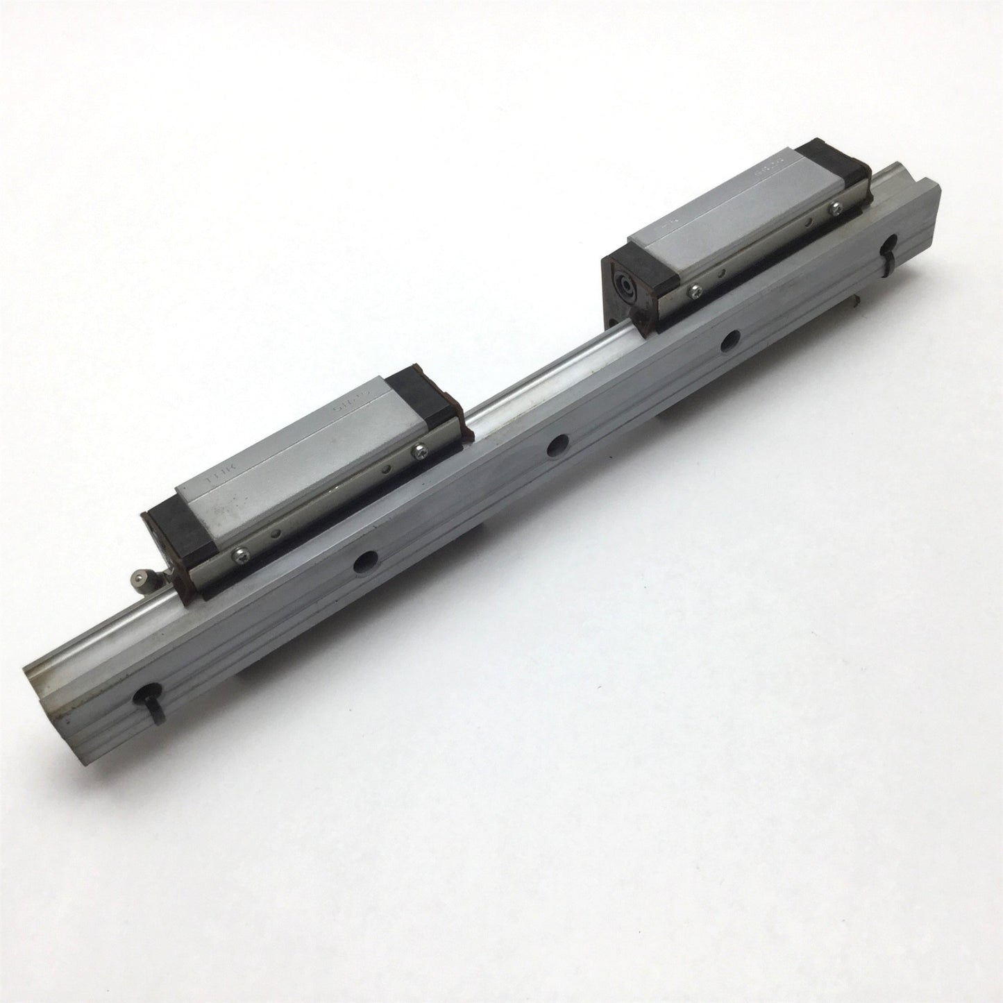 Used THK SR25 Linear Rail With 2x Carriages, 11" Long Rail, Carriage is Tapped M6