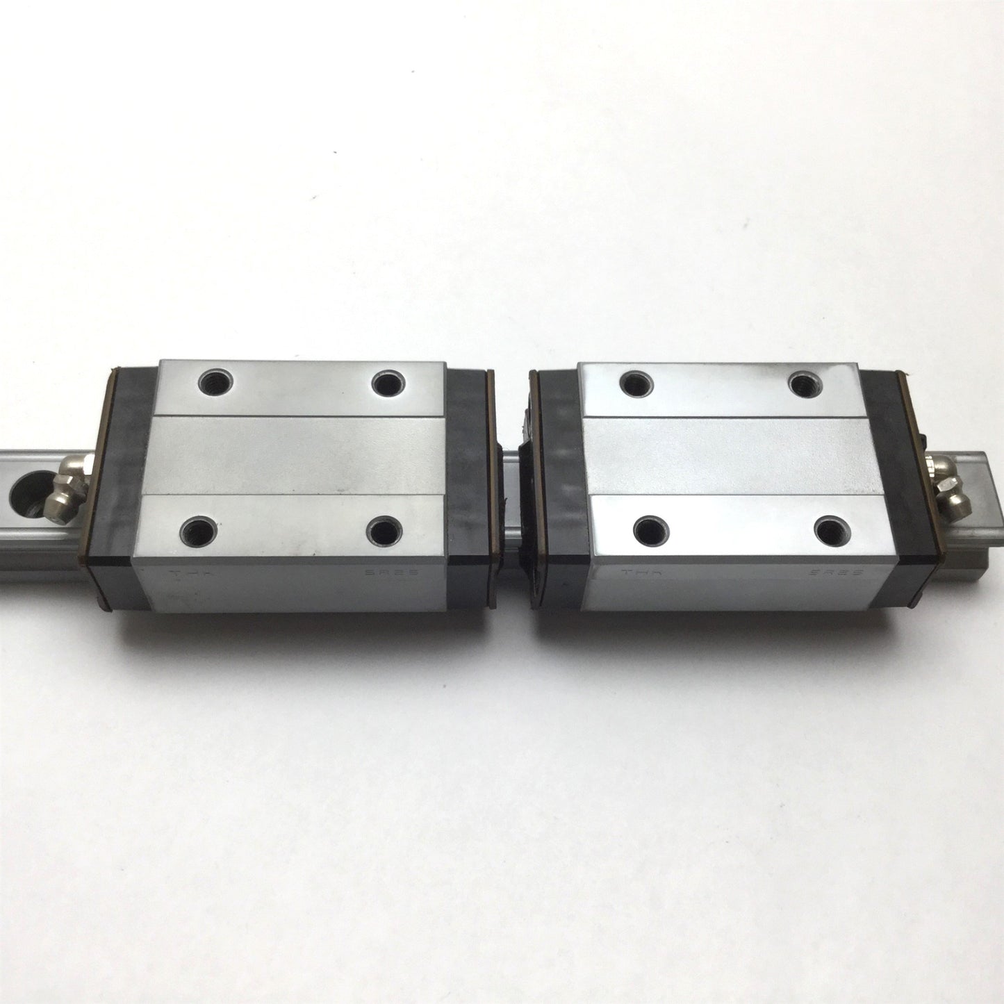 Used THK SR25 Linear Rail With 2x Carriages, 11" Long Rail, Carriage is Tapped M6