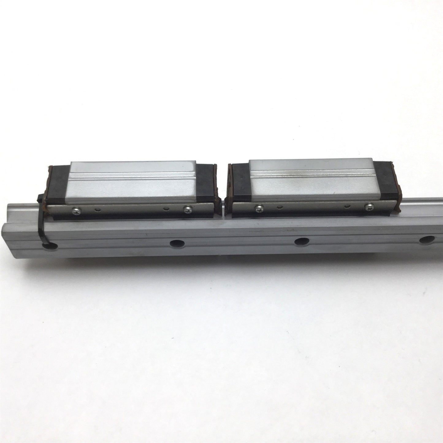 Used THK SR25 Linear Rail With 2x Carriages, 11" Long Rail, Carriage is Tapped M6