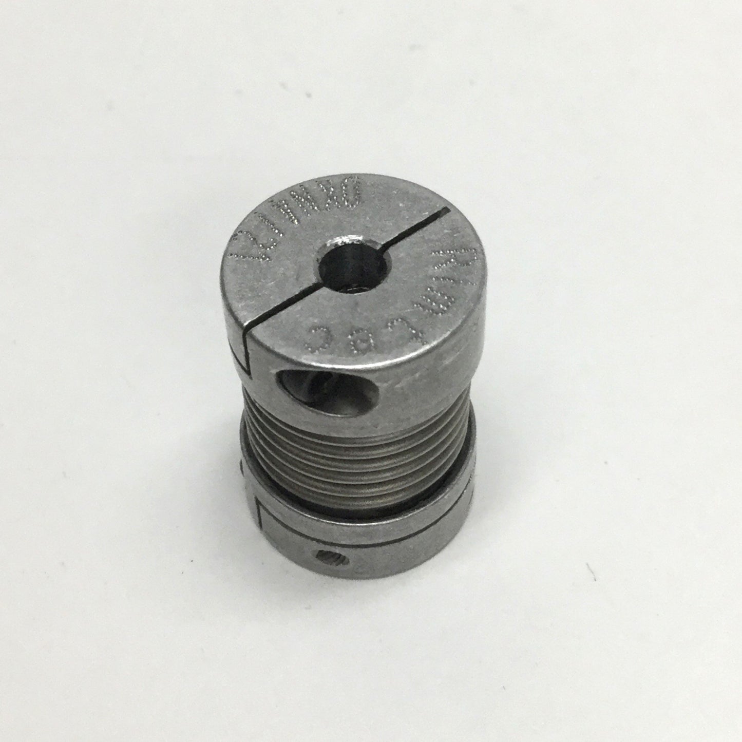 Used Rimtec DKN 4/21 Zero-Backlash Flexible Bellows Motor Shaft Coupling, 4mm to 1/4"