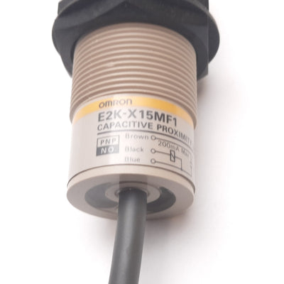 Used Omron E2K-X15MF1 Capacitive Proximity Sensor, 15mm, 12-24VDC 200mA, PNP N/C