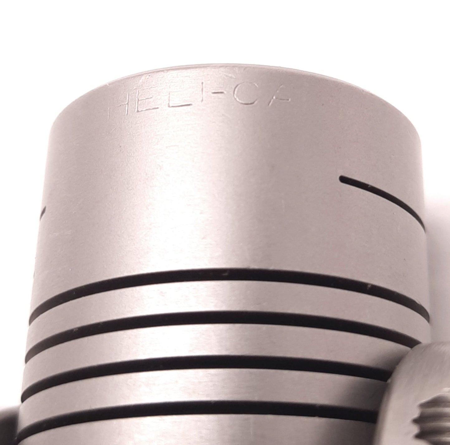 Used Helical HCR112-12-12 Flexible Steel Clamp Coupling, 0.375" Bore, 1.125" OD