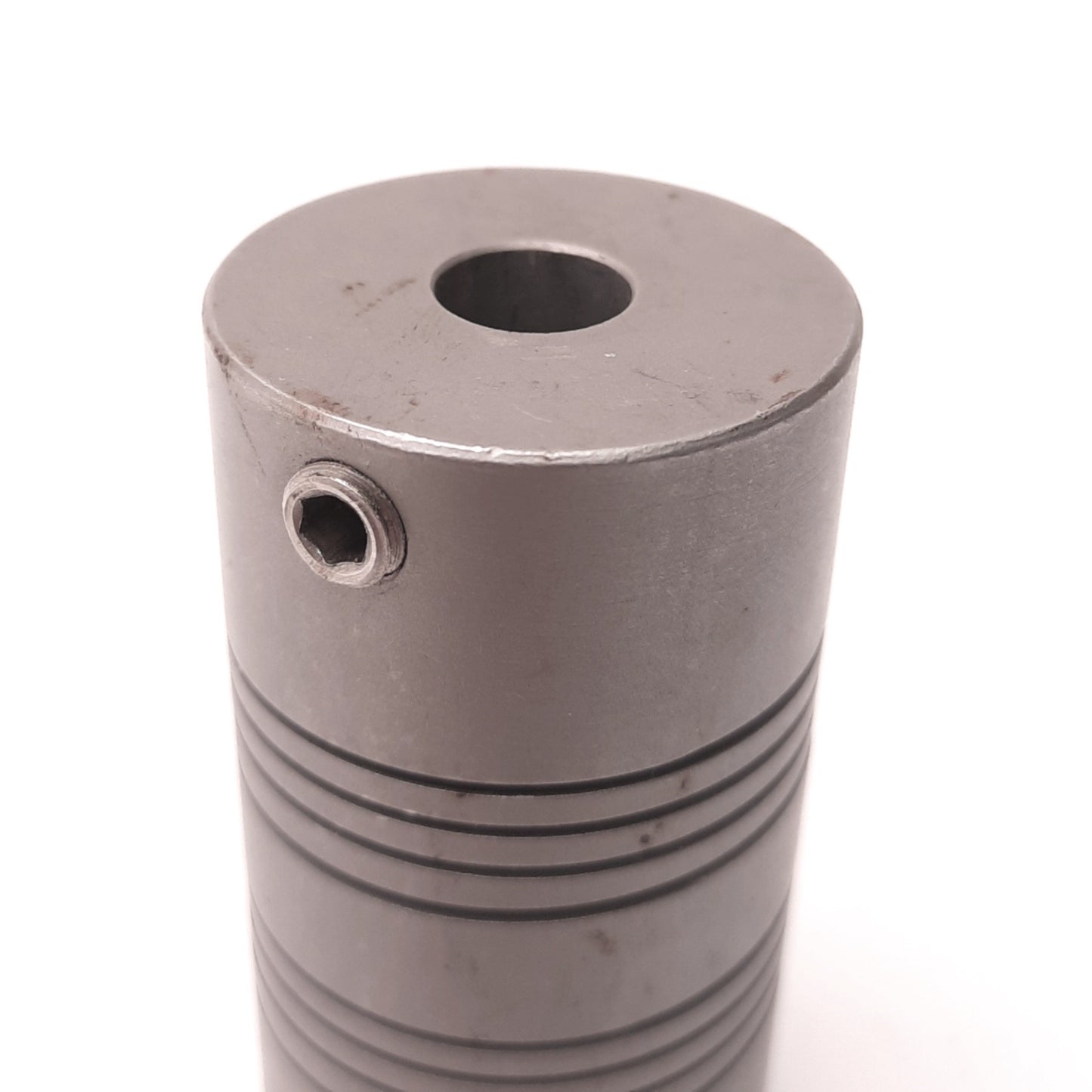 Used Helical MC7125-20-12 Flexible Coupling 0.625" to 0.375" Bore, 1.25" OD