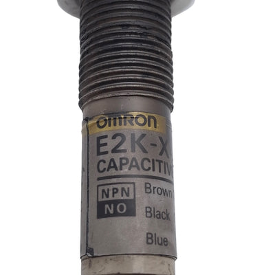 Used Omron E2K-X4ME1 Capacitive Proximity Sensor, NPN N/O, 4mm Range, 12-24VDC, M12