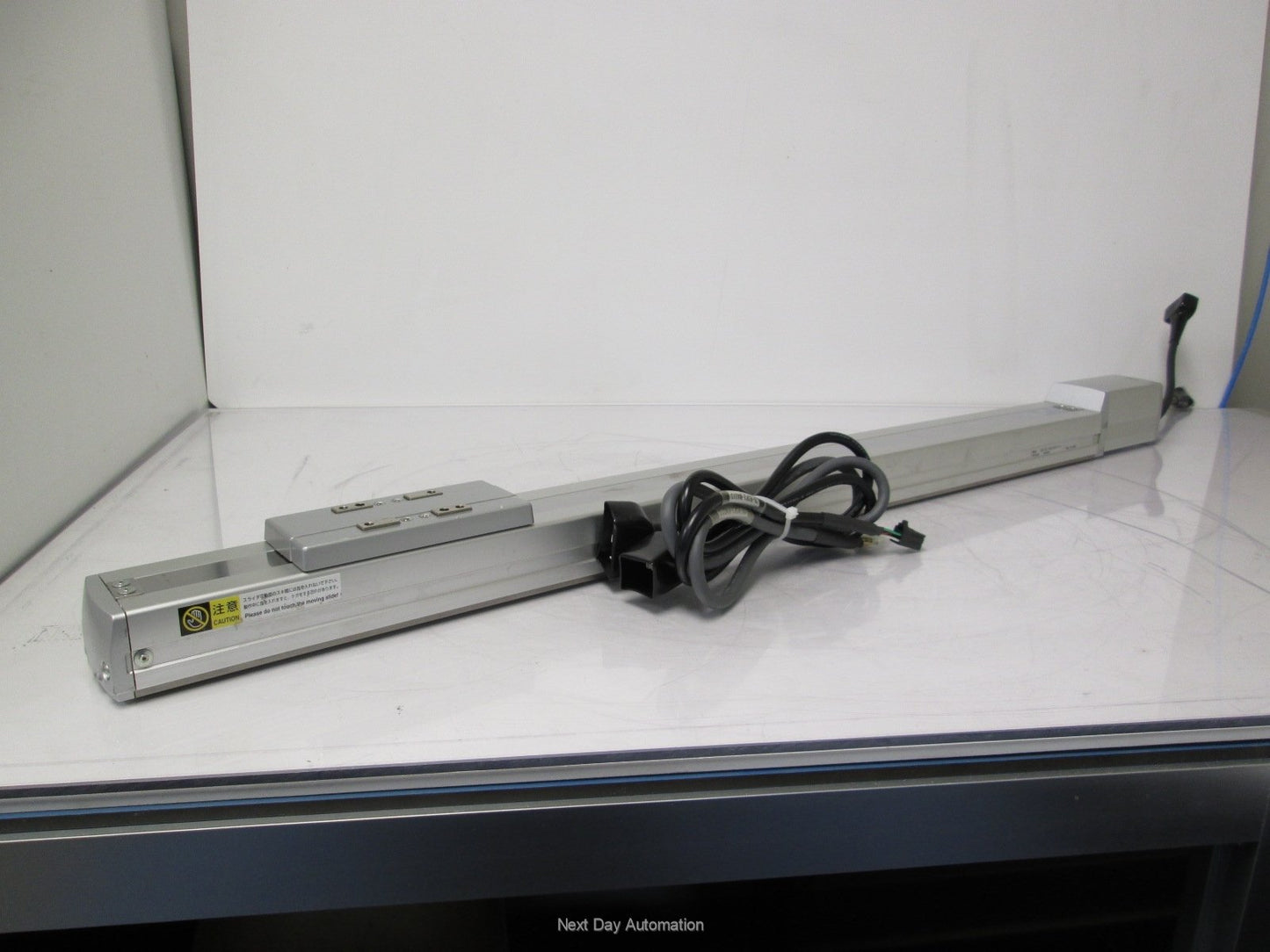 Used IAI RCP2-SS-I-PM-6-600-P1-P Slider w/ Iron Base 600mm Stroke *Dent in Cover*