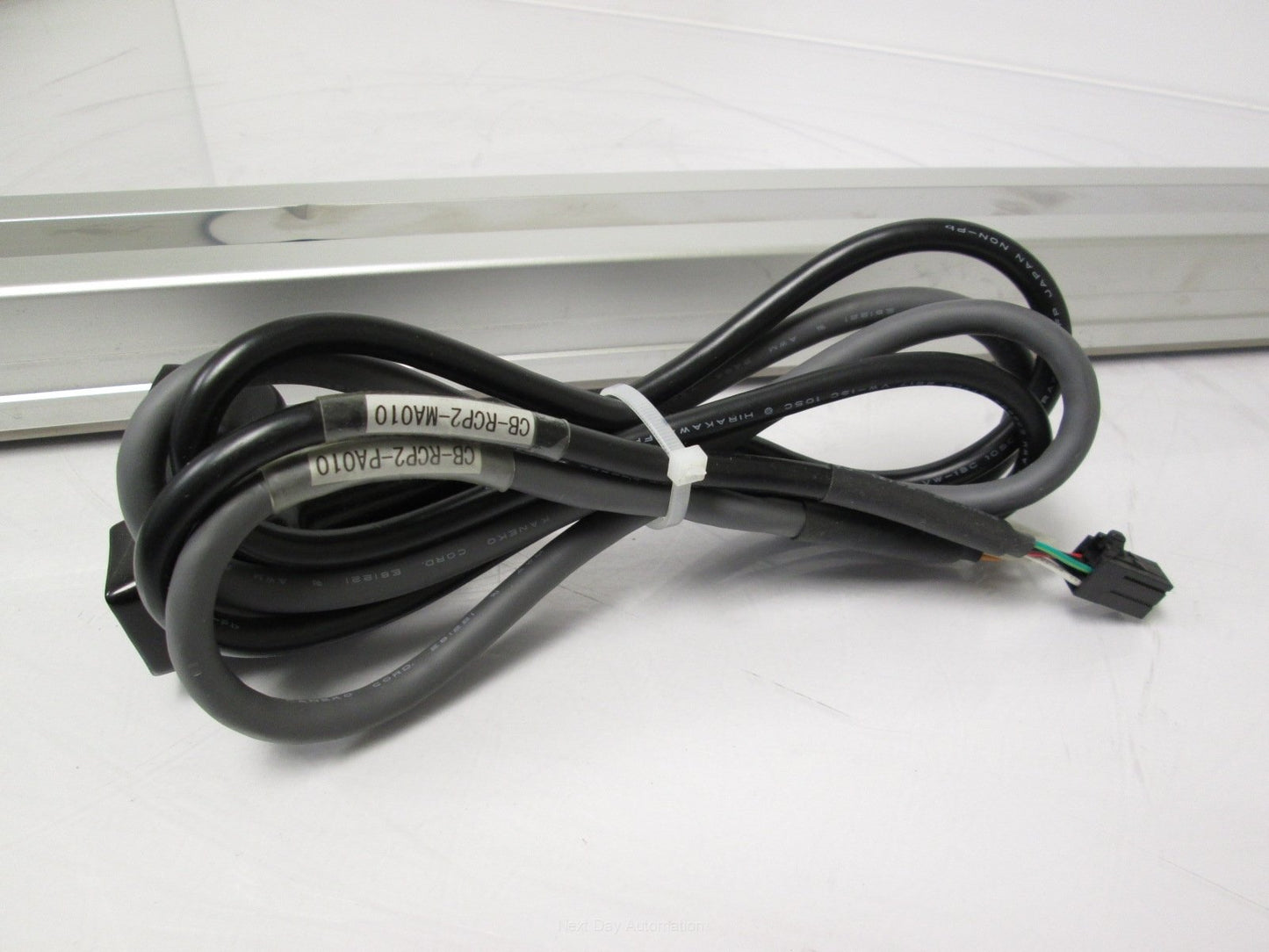 Used IAI RCP2-SS-I-PM-6-600-P1-P Slider w/ Iron Base 600mm Stroke *Dent in Cover*