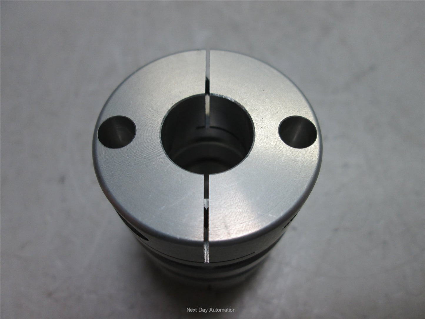 Used NBK Disk Type Coupling, 8mm to 12.7mm (5/16" to 1/2"), Material: Aluminum