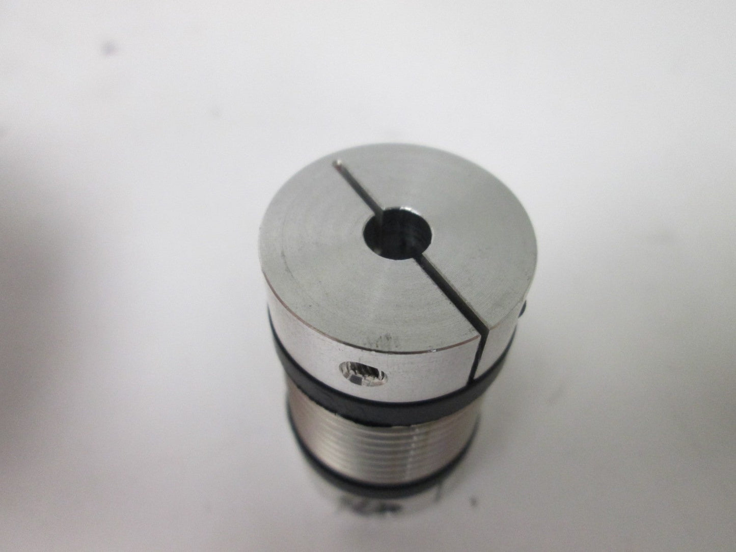 Used RW Bellows Coupling, 6mm ID to 0.5" ID, Dimensions: 25mm OD x 44mm Long