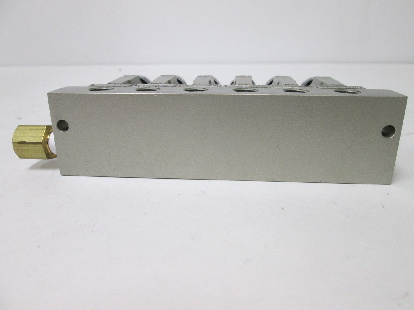 Used Bank of 6 SMC ARM1000 Manifold Regulators, With 0-150psi Gauge, 1/8" Ports