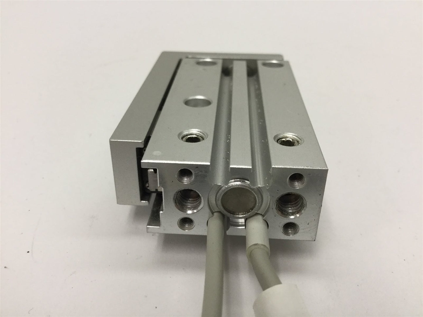 Used SMC MXH6-30 Pneumatic Slide Table, Stroke: 30mm, Bore: 6mm, W/ 2x D-M9P Sensors