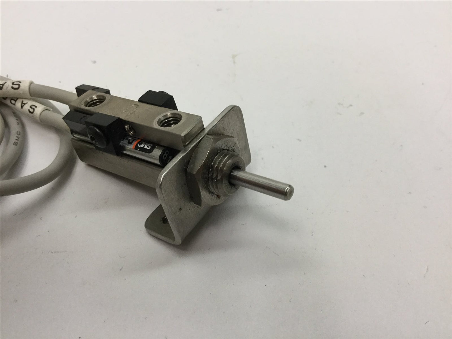 Used SMC NCDJPB6-037D-B Pin Cylinder, Stroke: 3/8", Bore: 1/4", With 2x D-93A Sensors