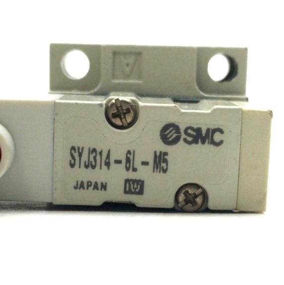 Used SMC SYJ314-6G-M5 Solenoid Valve & Manifold, 4-Way, 20-100PSI, M5-0.8 Ports,12VDC