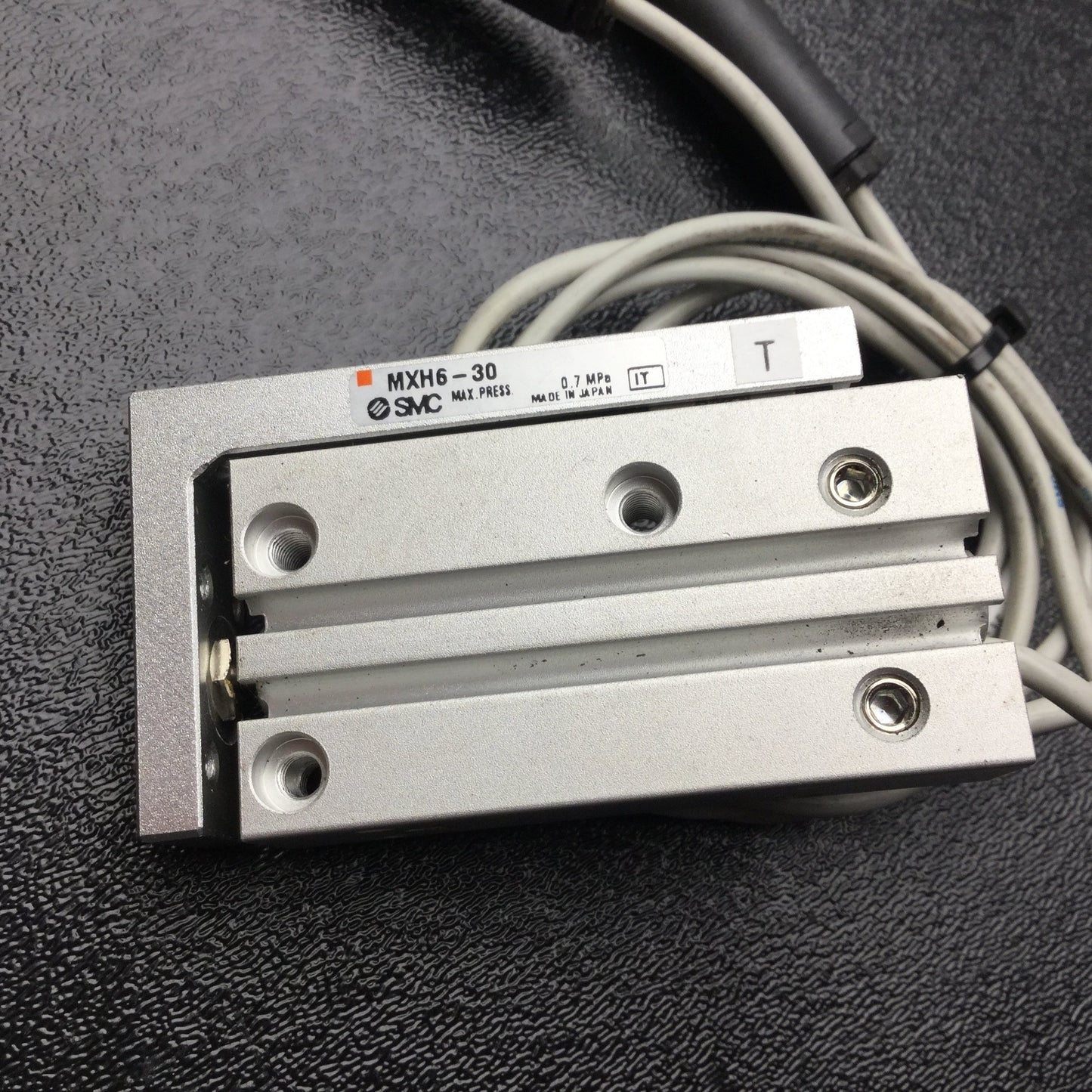 Used SMC MXH6-30 Pneumatic Slide Table, Ports: M5x0.8 10-32, Stroke: 30mm, Bore: 6mm