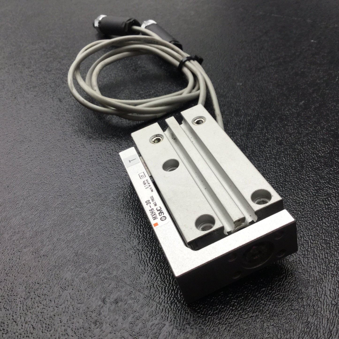Used SMC MXH6-30 Pneumatic Slide Table, Ports: M5x0.8 10-32, Stroke: 30mm, Bore: 6mm