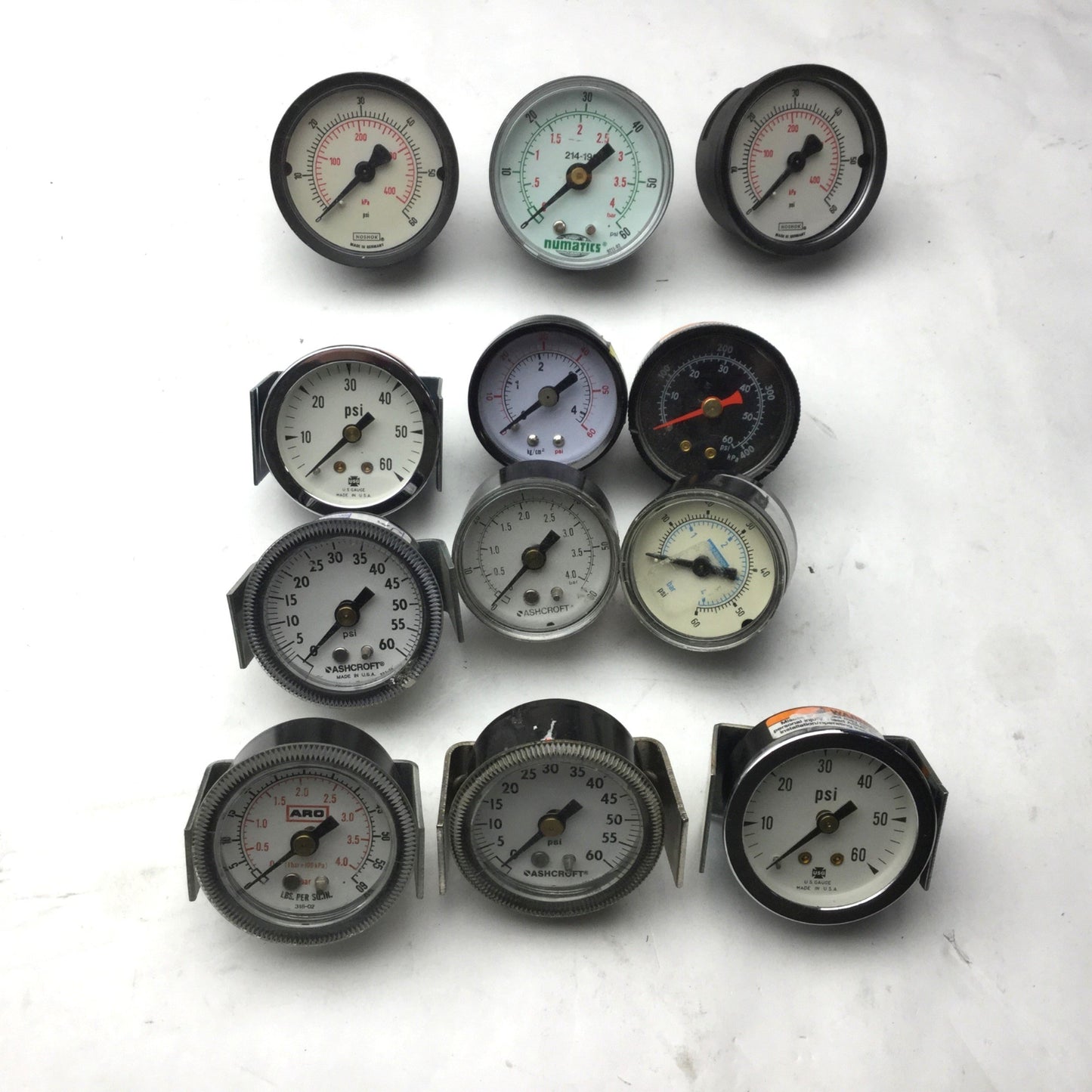 Used Lot of 12 Miscellaneous Pressure Gauges, 9x 1/8" NPT, 3x 1/4" NPT, 0-60 PSI