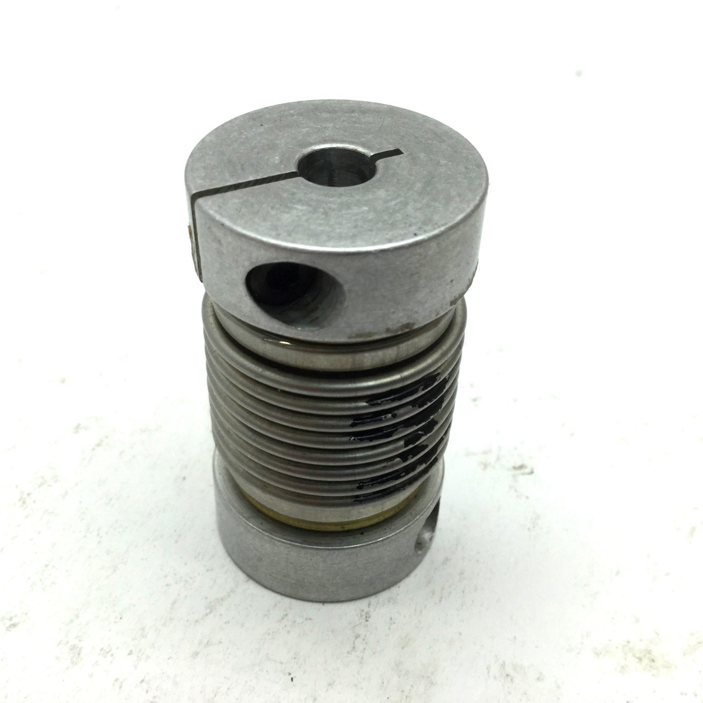 Used Flexible Shaft Clamping Coupling, OD: 1" ID: 1/4" Length: 1-11/16"