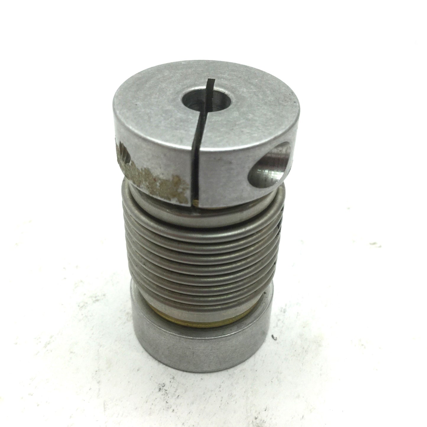 Used Flexible Shaft Clamping Coupling, OD: 1" ID: 1/4" Length: 1-11/16"