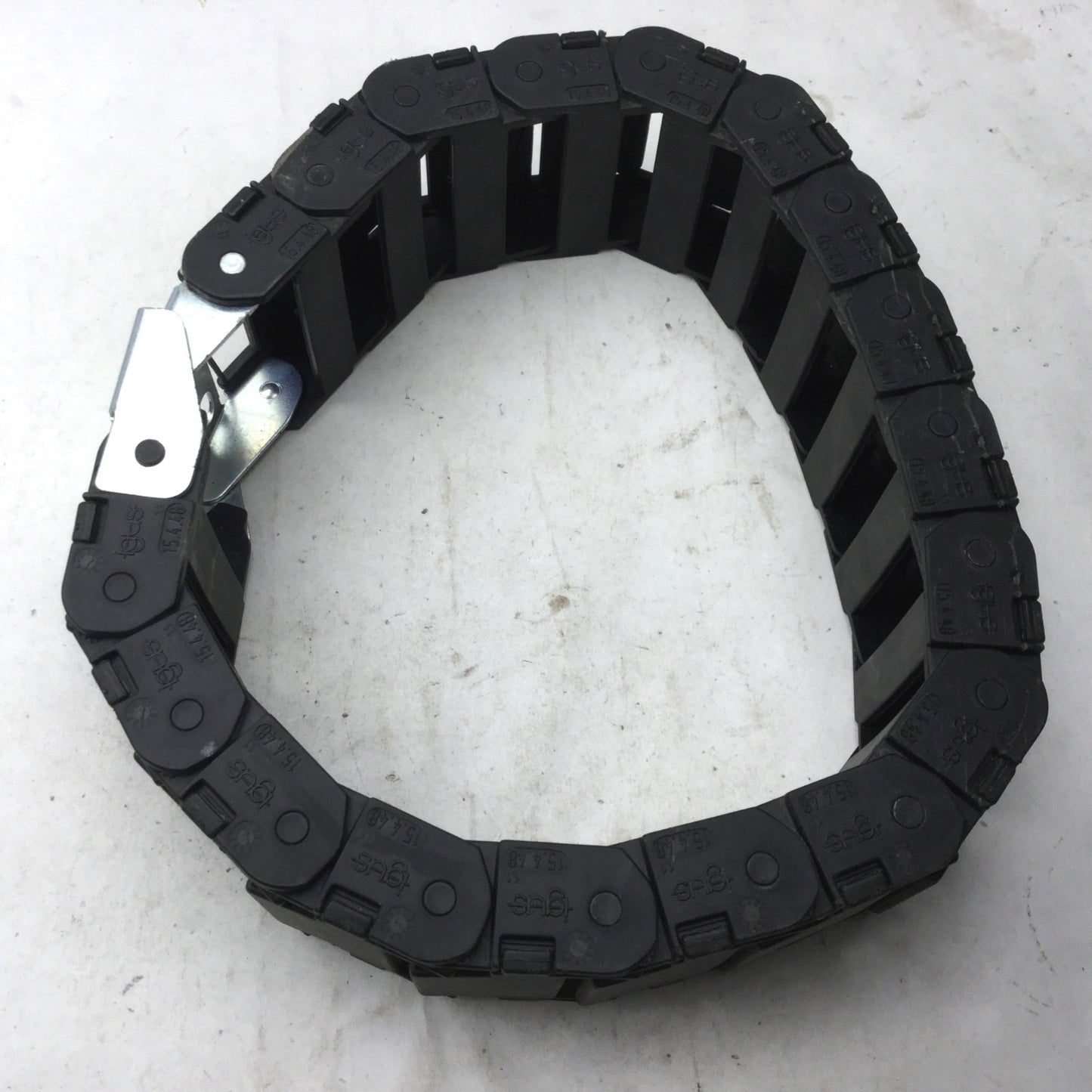 Used Igus 15.4.48 Energy Chain, Dimensions: 22"(L) x 2-3/8"(W) x 15/16"(H), 18 Links