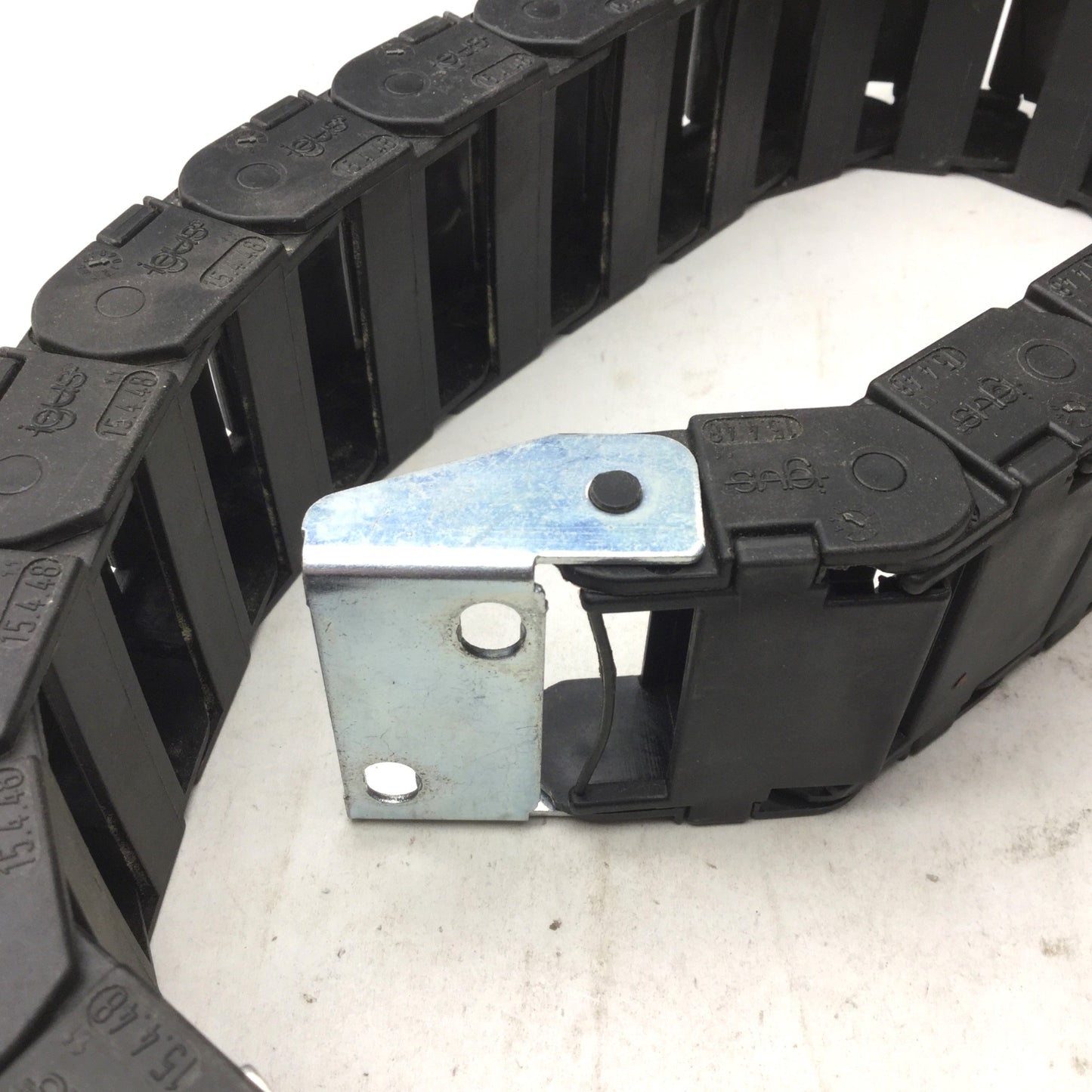 Used Igus 15.4.48 Energy Chain, Dimensions: 23.5"(L) x 2-3/8"(W) x 15/16"(H) 19 Links