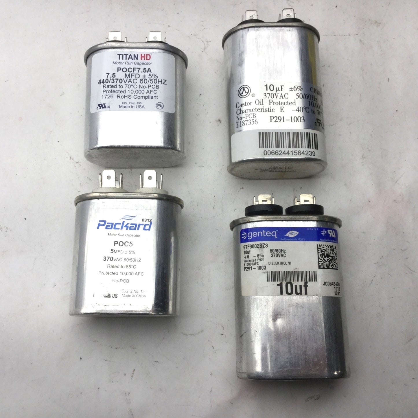 Used Lot of 4 Miscellaneous Capacitors, New POC5, New POCF7.5A, 2x P291-1003