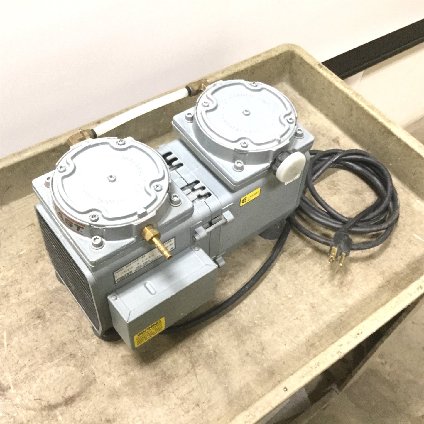 Used Gast DAA-V157-EB Vacuum Pump, Voltage 110/115V, Ports 1/4" NPT, Tested to 23inHg