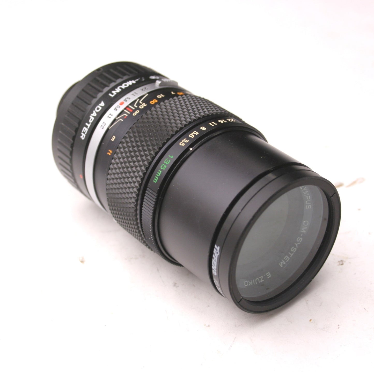 Used Olympus OM-System E. Zuiko AUTO-T 1:35 F=135mm, C Adapter, Tiffen 52mm SKY 1-A