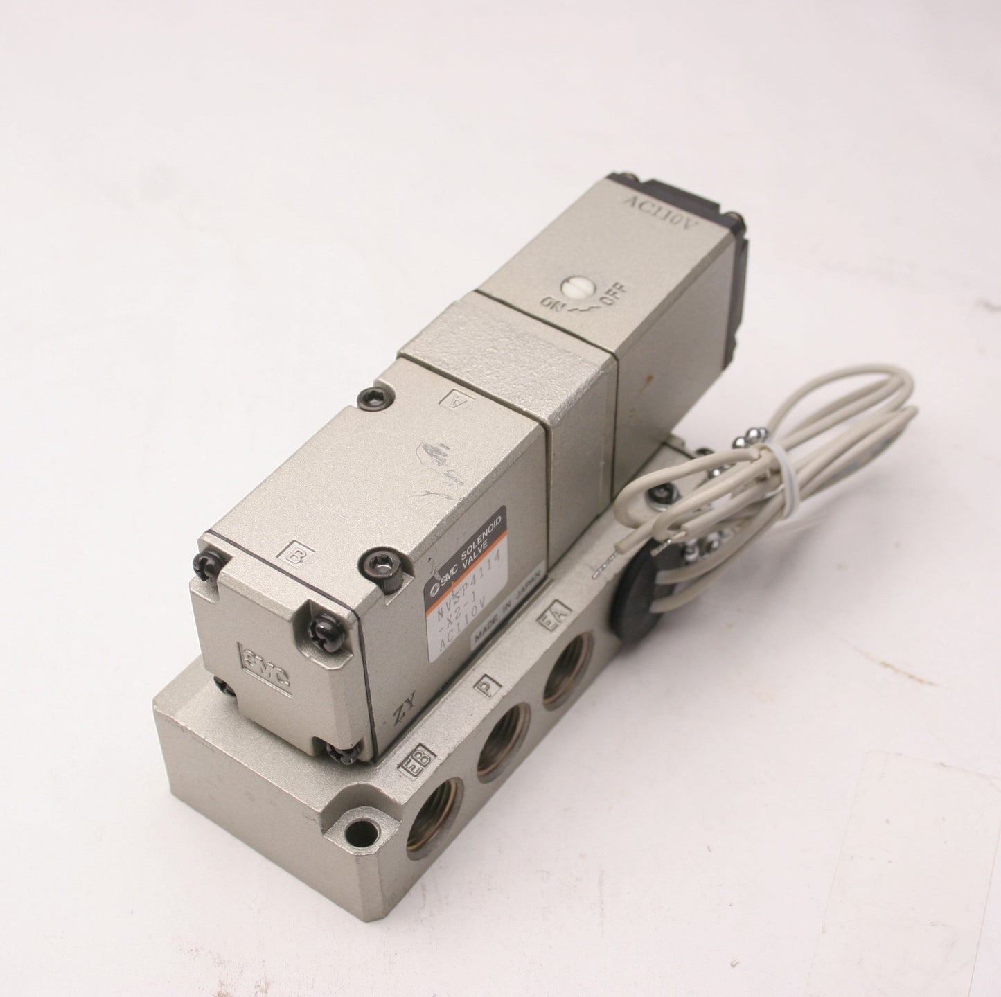 Used SMC NVSP4114-X2-1 Solenoid Valve, Voltage: 110VAC, 5 Ports, With Base