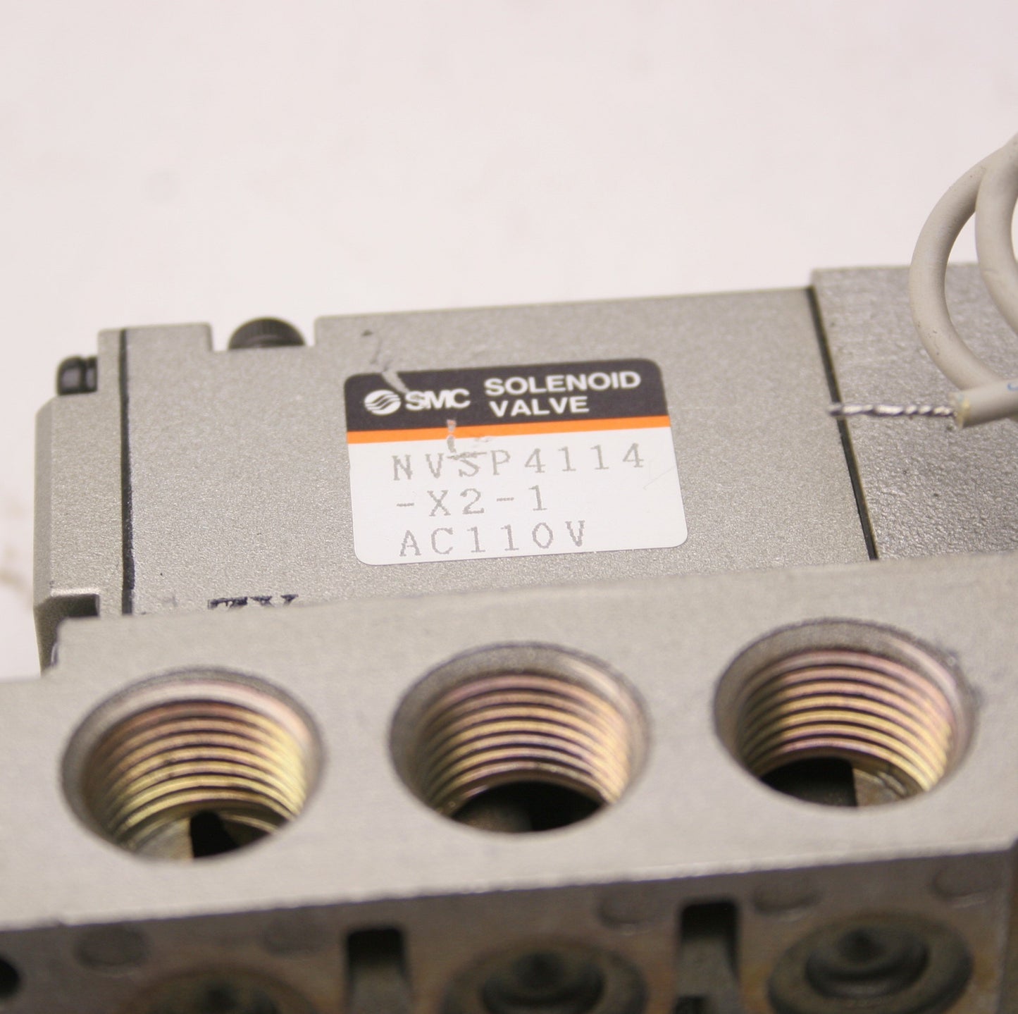 Used SMC NVSP4114-X2-1 Solenoid Valve, Voltage: 110VAC, 5 Ports, With Base