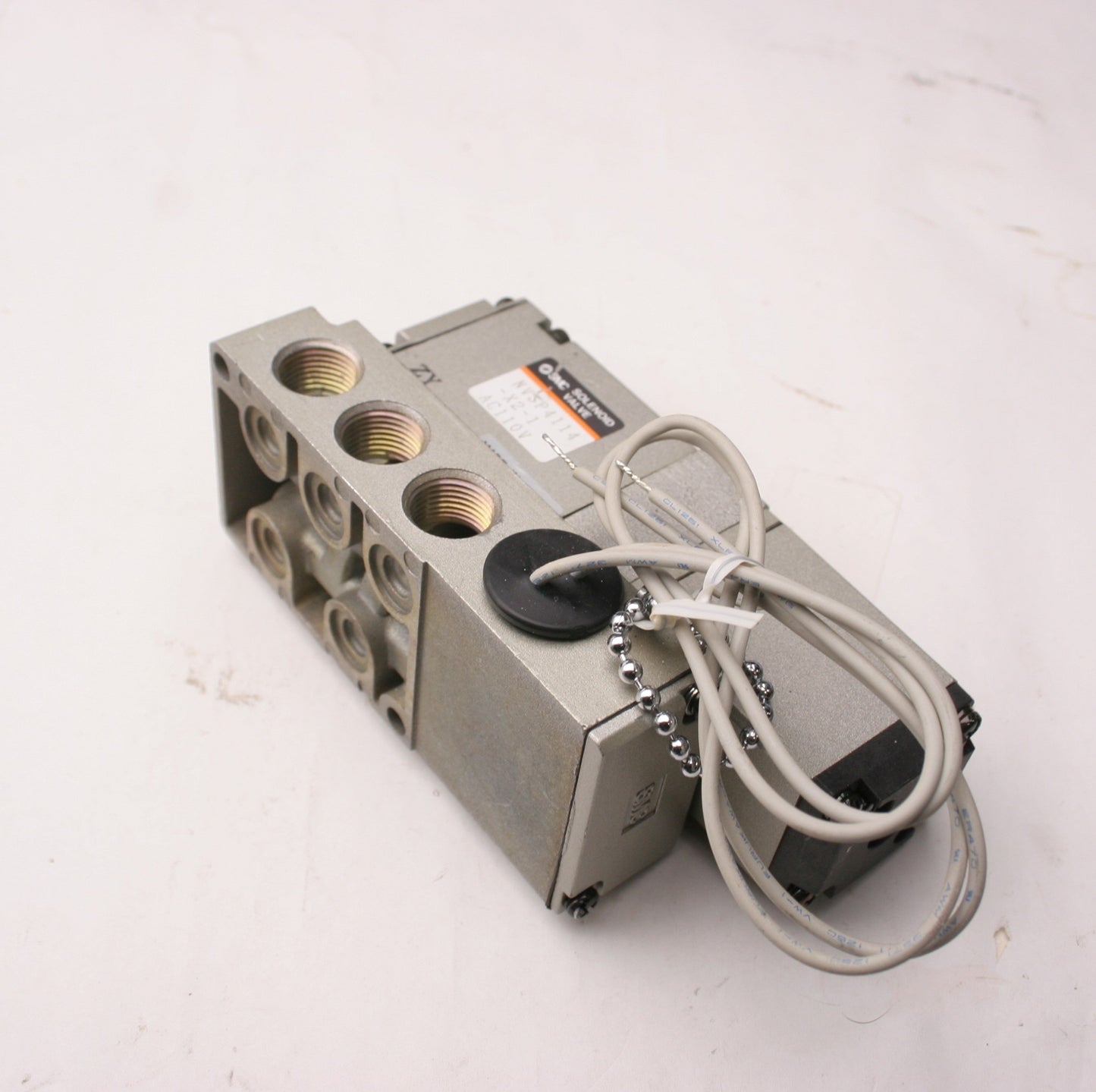 Used SMC NVSP4114-X2-1 Solenoid Valve, Voltage: 110VAC, 5 Ports, With Base