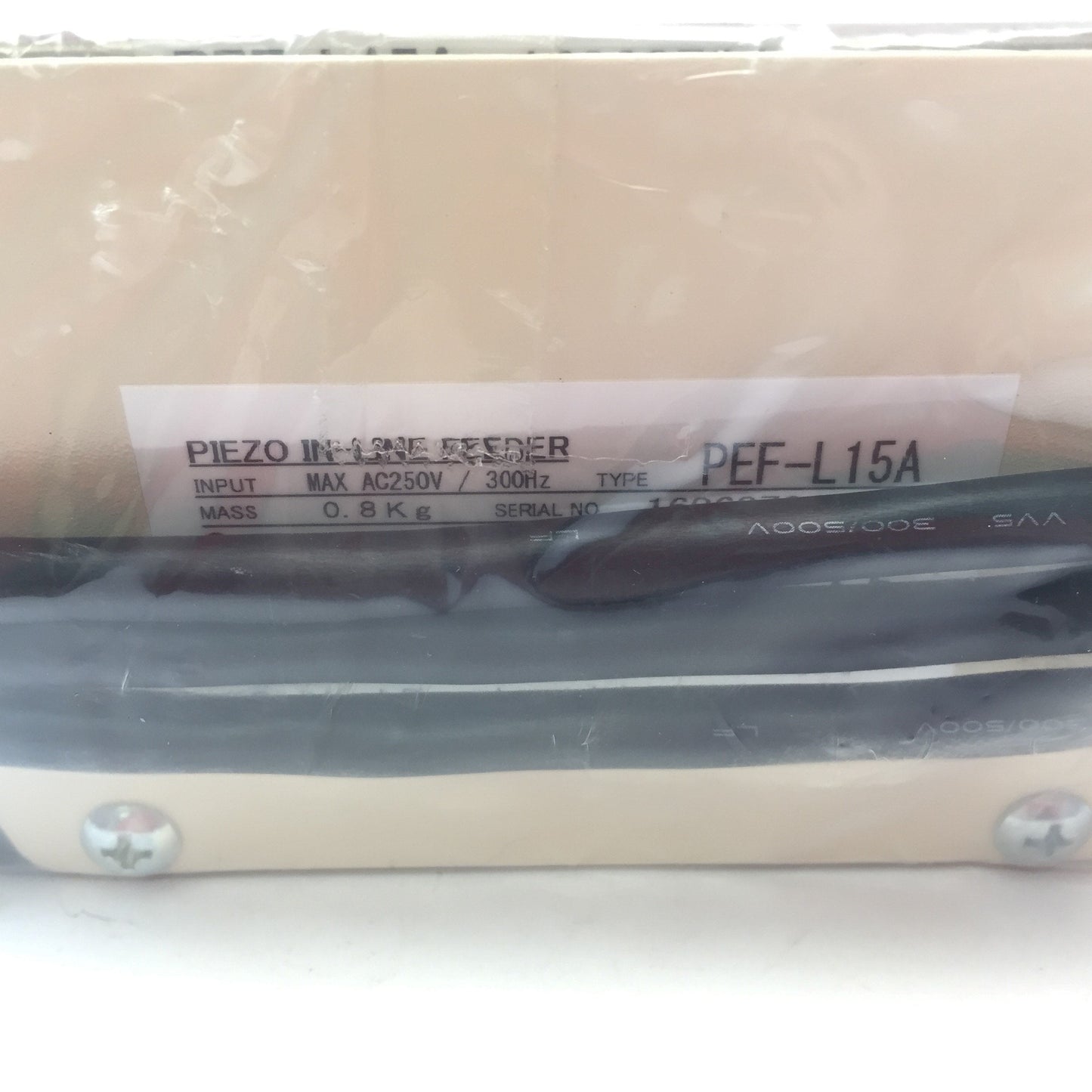 New Sanki Piezo PEF-L15A Vibratory In-line Feeder, Input: 250VAC 300Hz, Mass: 0.8kg