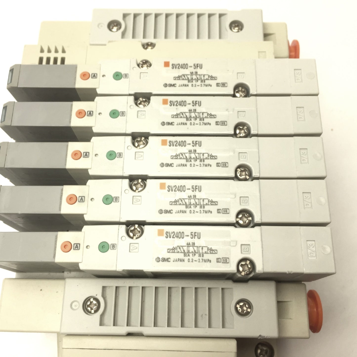 Used SMC Manifold w/ 5x SV2400-5FU Pneumatic Solenoid Valves, Coil Voltage: 24VDC