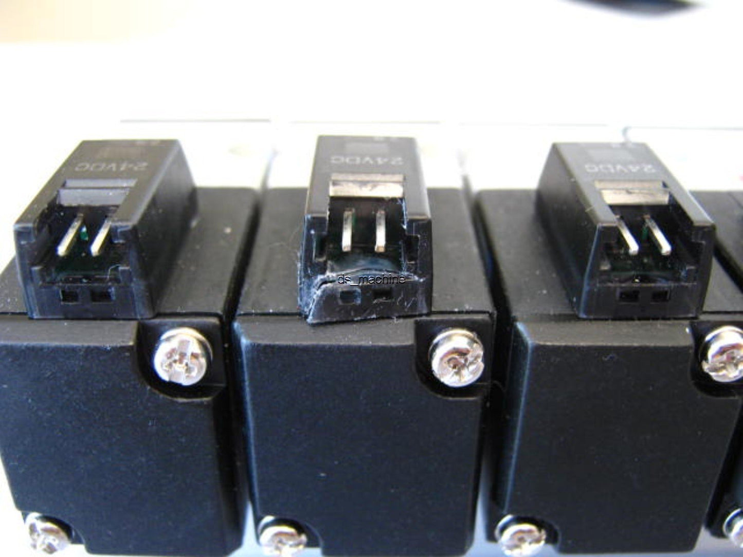 Used Bank of 8 Koganei A025E1-PSL Pneumatic Solenoids 24VDC w/Slight Damage