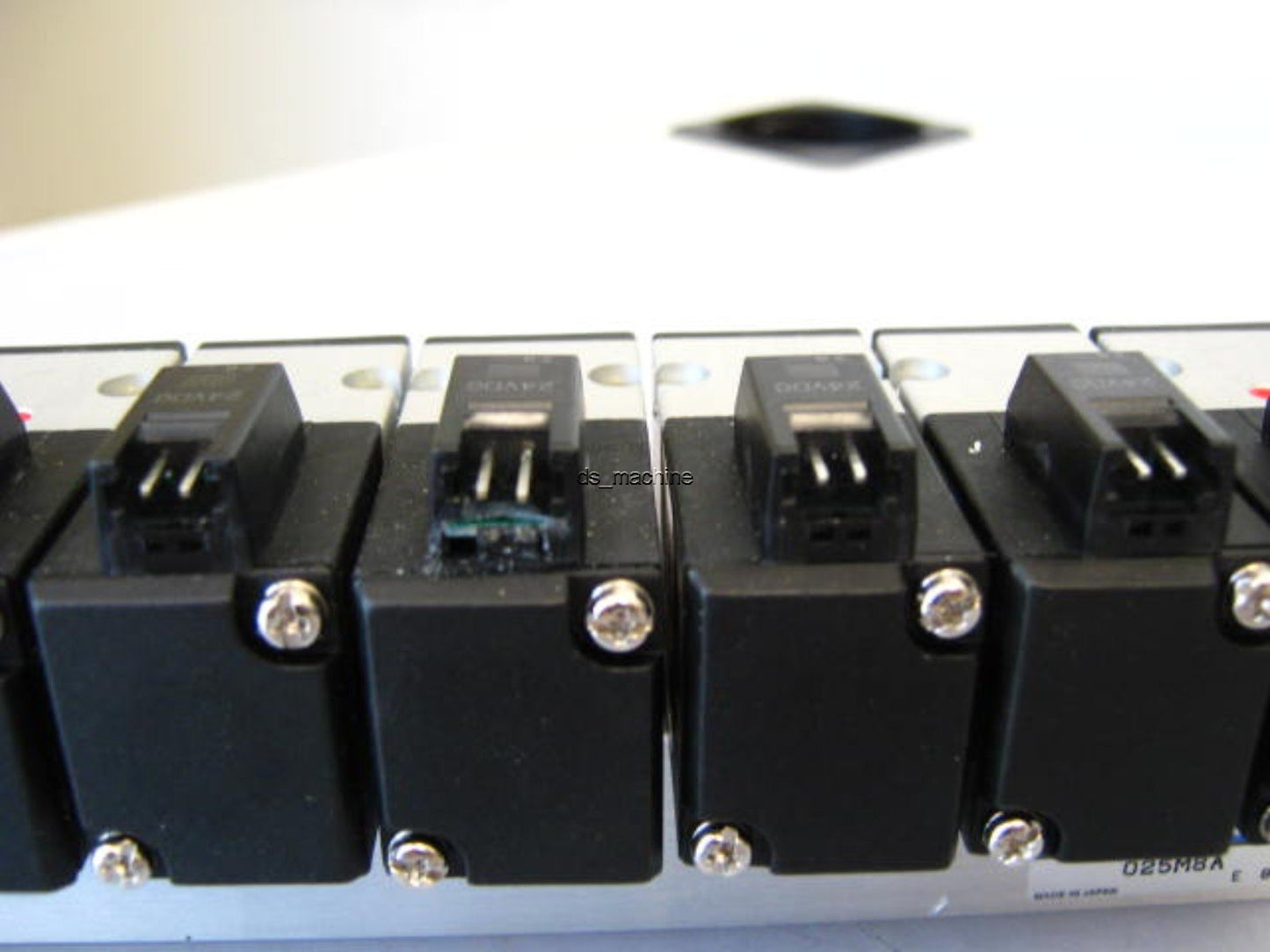 Used Bank of 8 Koganei A025E1-PSL Pneumatic Solenoids 24VDC w/Slight Damage