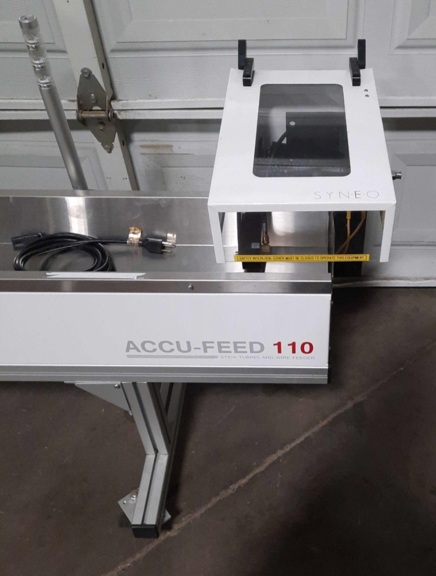 Used  SYNEO Accu-Feed 110 Center Pick Feeder 1Part/2sec 25"/sec 96" Material 120VAC