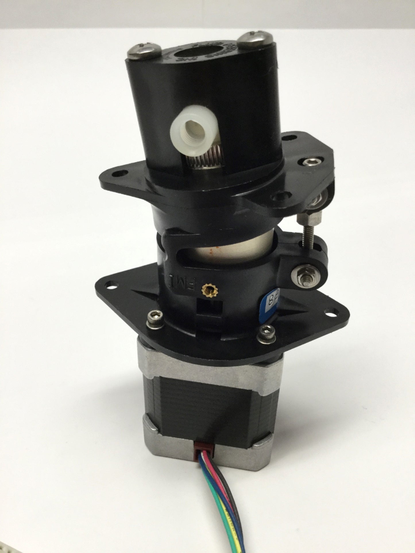 Used FMI STH Low Flow Fluid Metering Pump Assembly w/ 4VDC 1.8° Stepper Motor