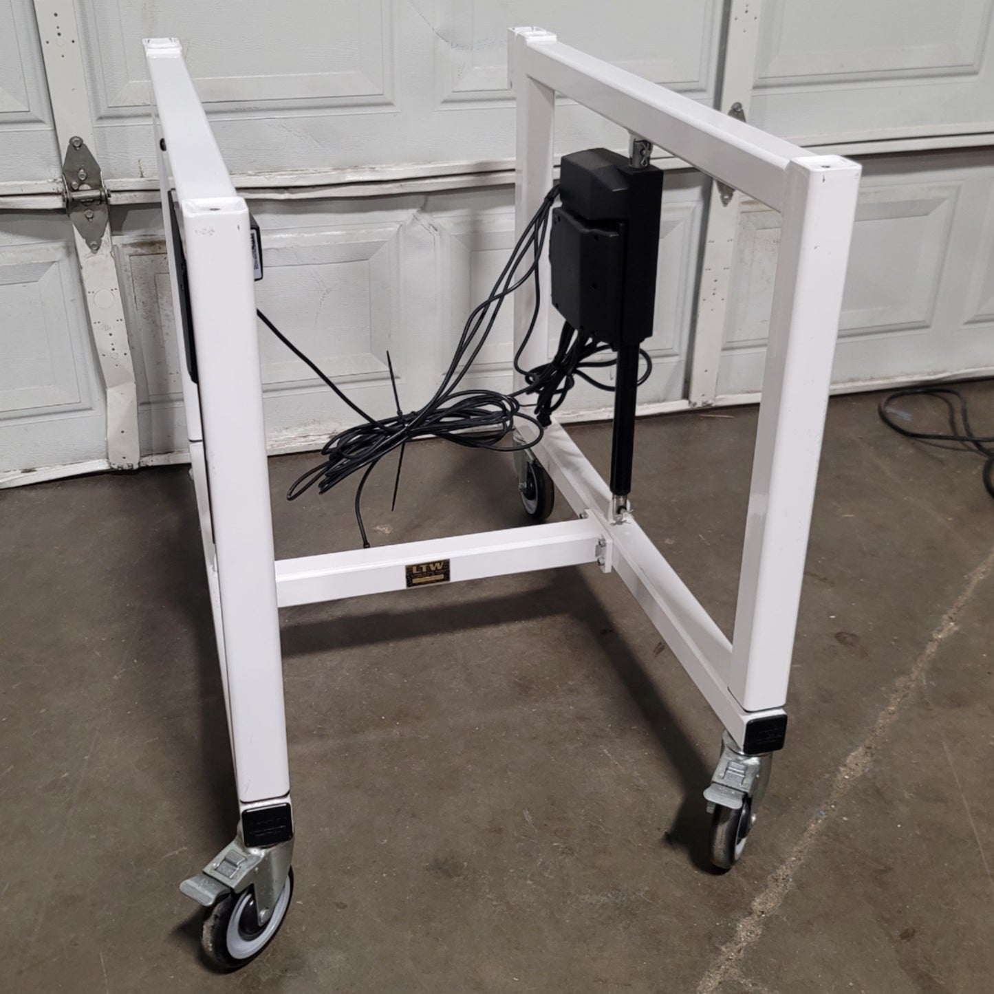 Used LTW E2 Ergonomic Adjustable Height Industrial Machine Base 24"W x 36"D, 12" Lift