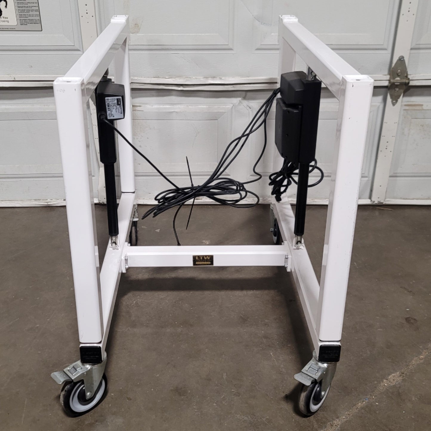 Used LTW E2 Ergonomic Adjustable Height Industrial Machine Base 24"W x 36"D, 12" Lift