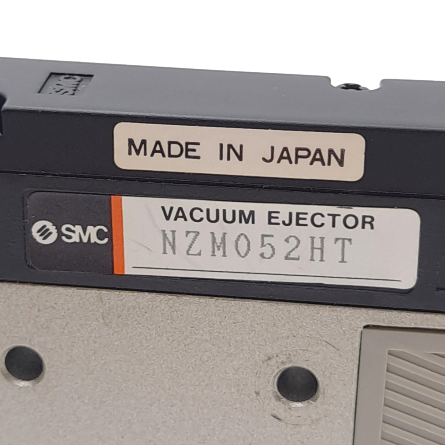 Used SMC NZM052HT Vacuum Ejector, -630mmHg, 100Psi Max, 1/8in NPTF, 24VDC Coil