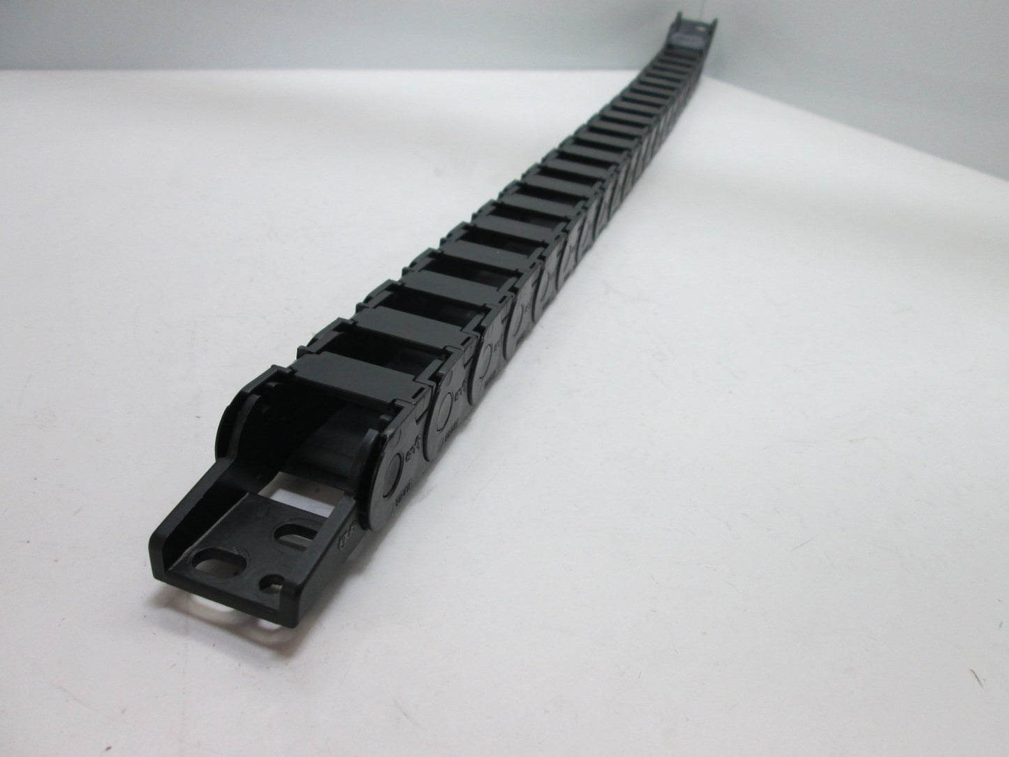 Used Igus 14.2.028 Energy Chain, Dimensions: 28.5" x 7/16" x 1", Mounting Brackets