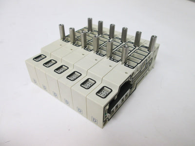 Used Bank of 6 SMC SV2000-50-1A-N7 Manifold Blocks, Voltage Rating: 12/24VDC