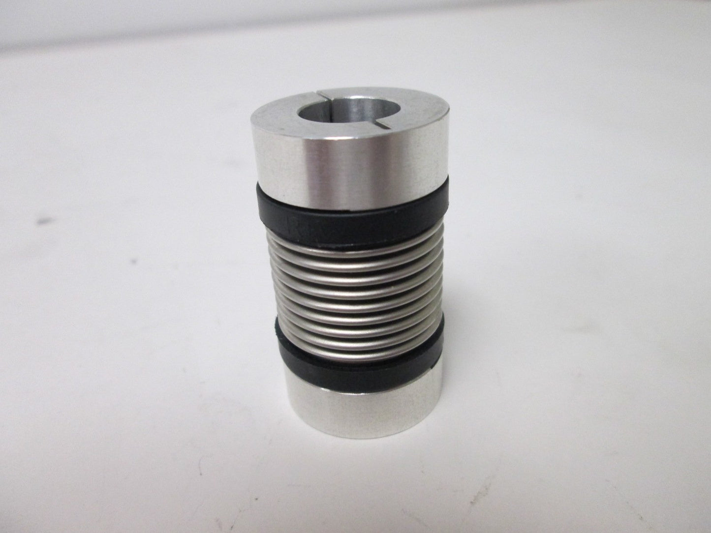 Used RW Bellows Coupling, 6mm ID to 0.5" ID, Dimensions: 25mm OD x 44mm Long