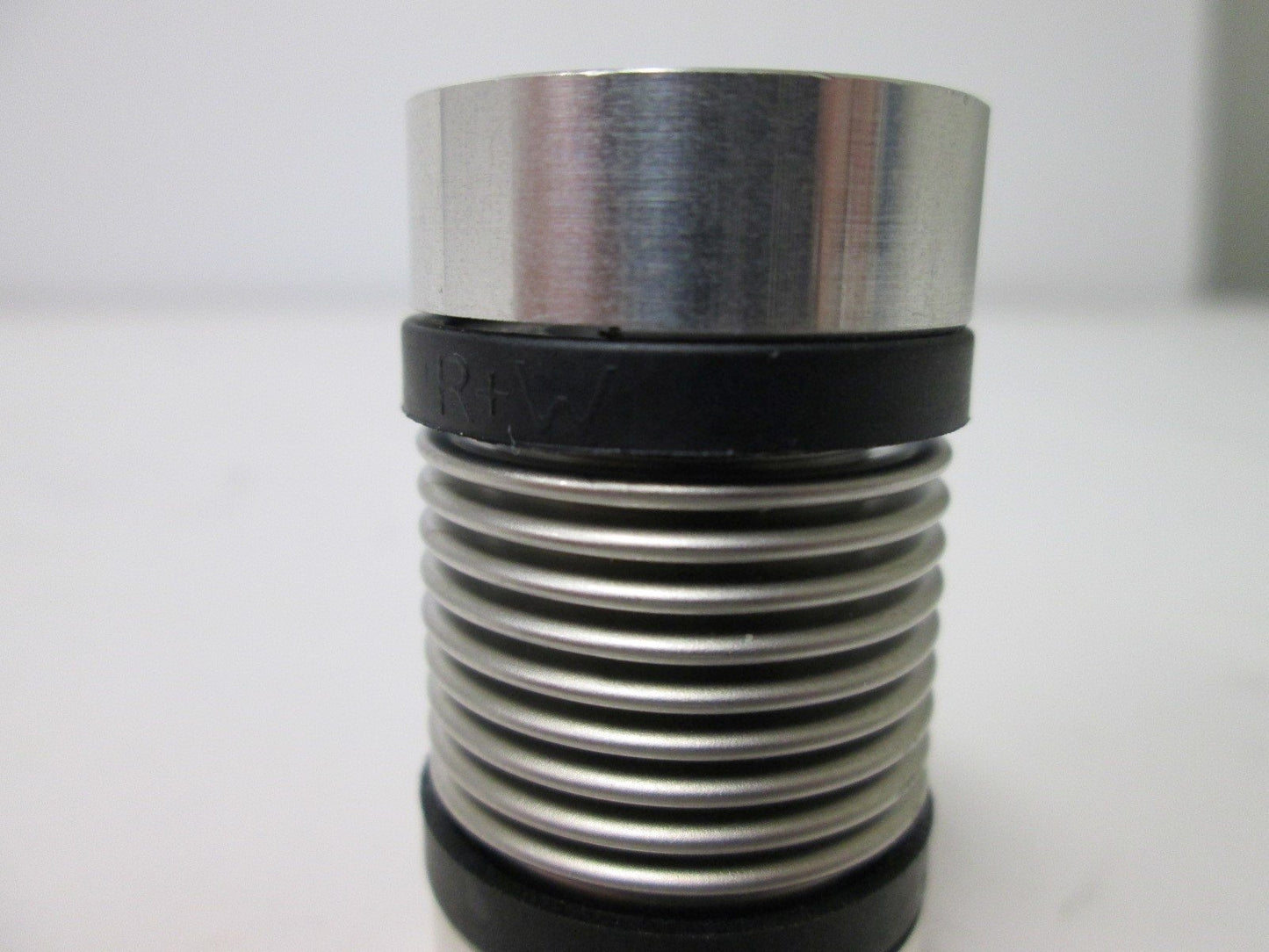Used RW Bellows Coupling, 6mm ID to 0.5" ID, Dimensions: 25mm OD x 44mm Long