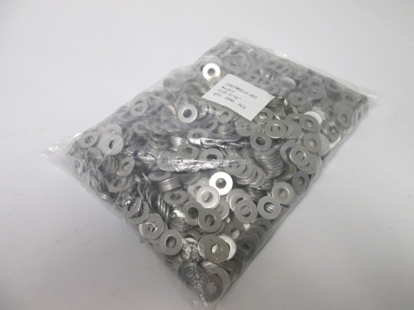 New Lot of 2000 Washers, Size: 5/16", Outside Diameter: 0.7", Thickness: 0.06"