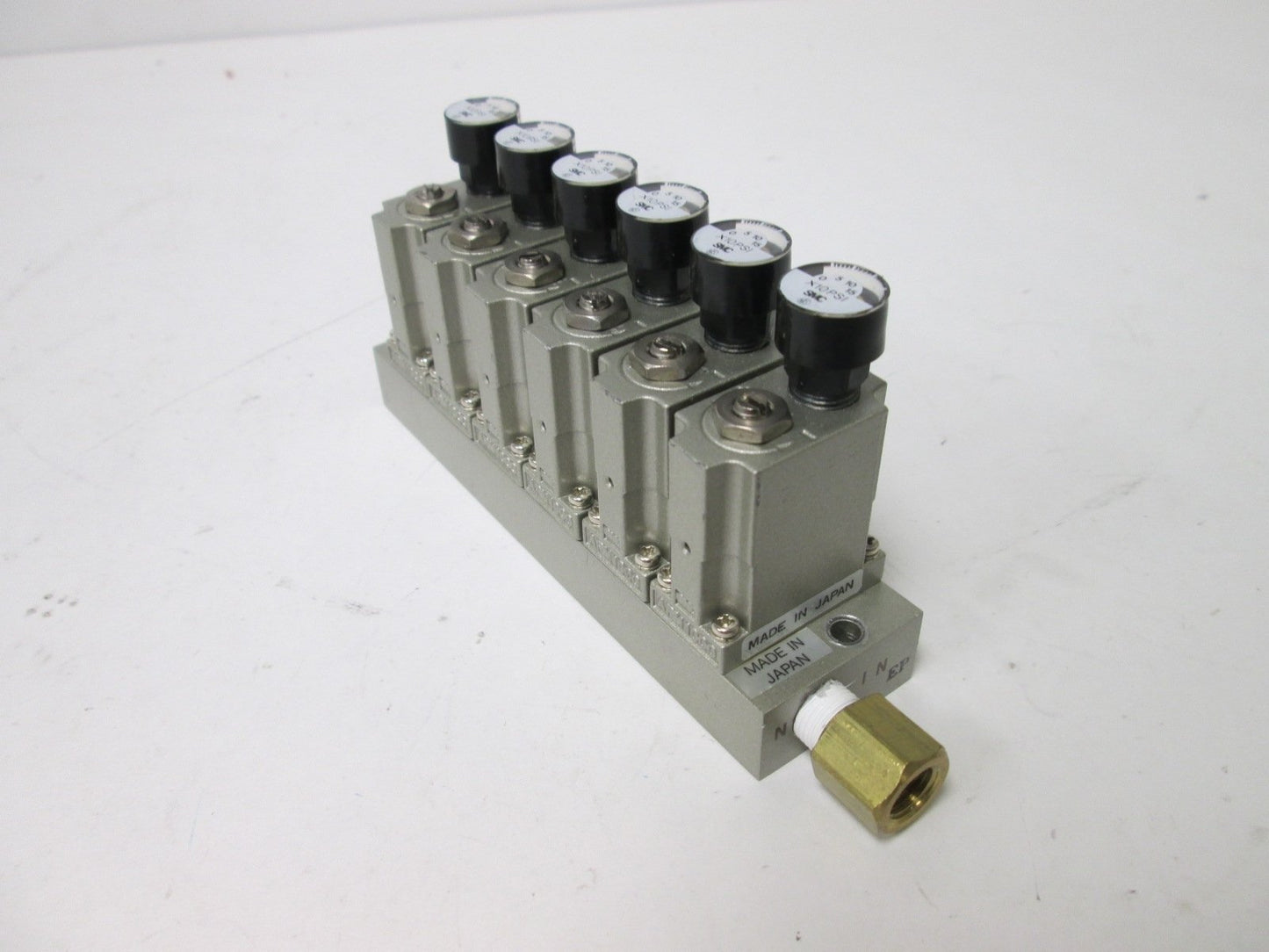 Used Bank of 6 SMC ARM1000 Manifold Regulators, With 0-150psi Gauge, 1/8" Ports