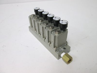 Used Bank of 6 SMC ARM1000 Manifold Regulators, With 0-150psi Gauge, 1/8" Ports